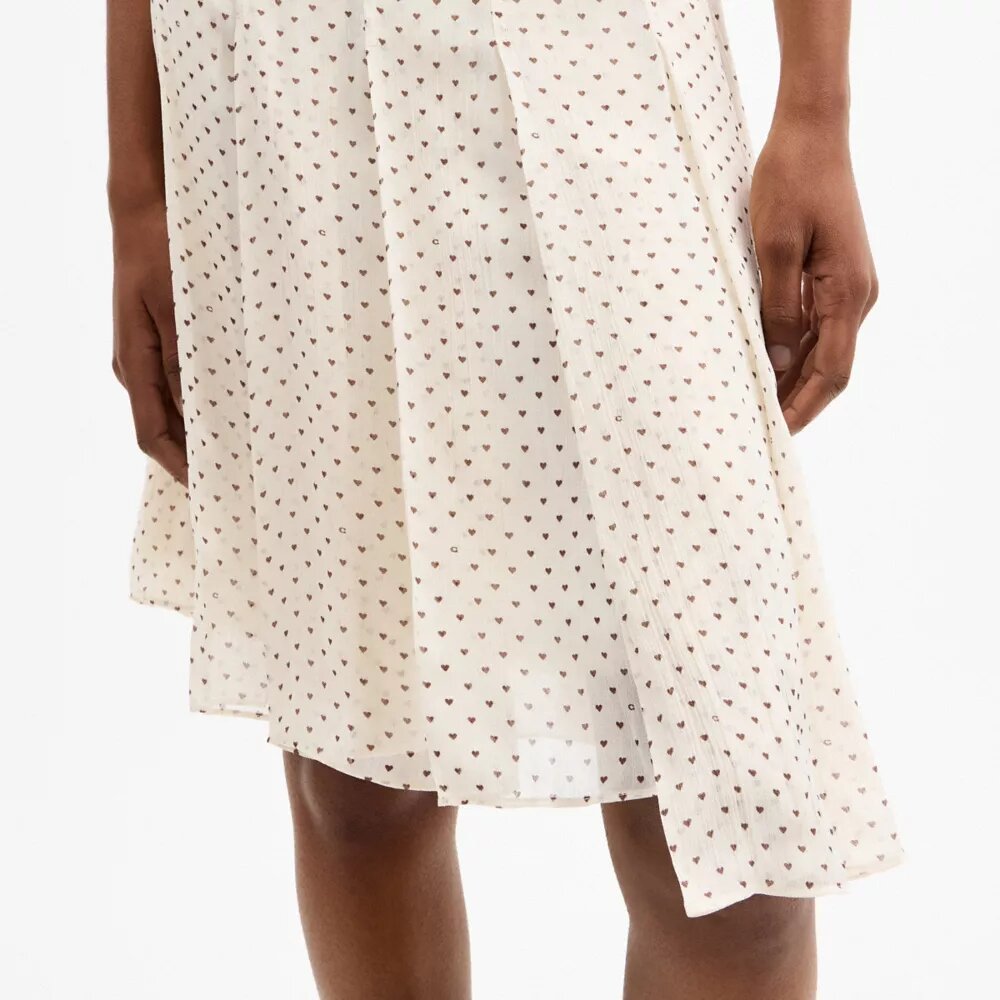 Asymmetrisk plisseret nederdel med print