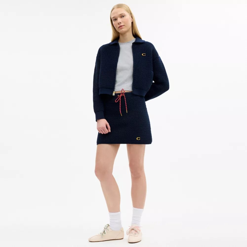 Cardigan med lynlås foran