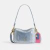 Carey crossbody-taske i Loved Denim med vedhæng