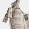 Carmen Mini-crossbody-taske med avistryk
