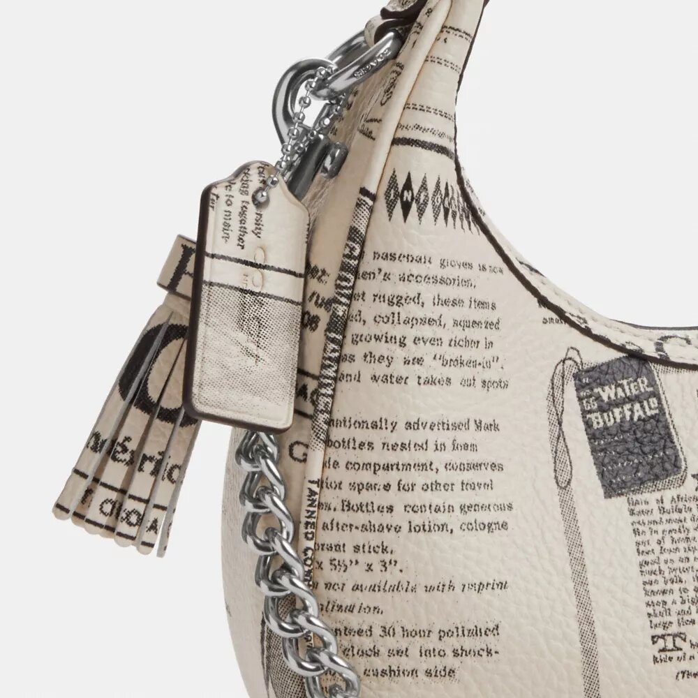 Carmen Mini-crossbody-taske med avistryk