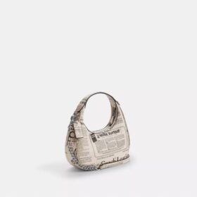 Carmen Mini-crossbody-taske med avistryk
