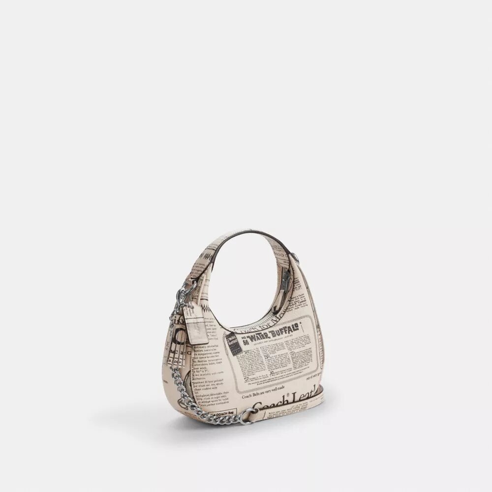 Carmen Mini-crossbody-taske med avistryk