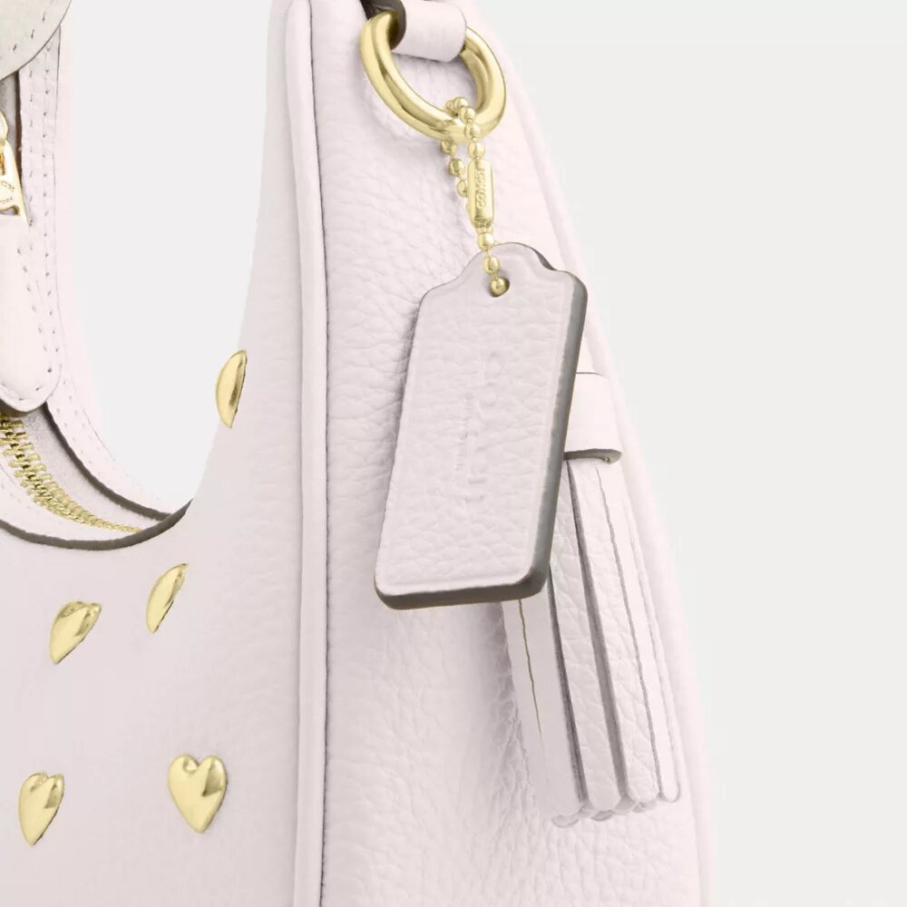 Carmen Mini-crossbody-taske med hjerteformede nitter