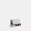 Charter Slim crossbody-taske i Signature Canvas