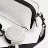 Charter Slim crossbody-taske i Signature Canvas