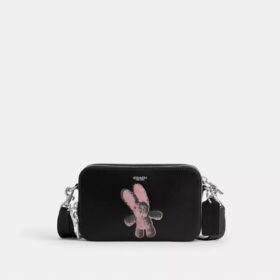 Clinton crossbody-taske med blødt grafisk motiv
