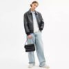 Dakota crossbody-taske i Signature Canvas