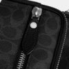 Dakota crossbody-taske i Signature Canvas
