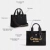 Disney X Coach Cargo Tote-tasker 26 med Mickey Mouse i regenerativt bomuldslærred