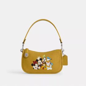 Disney X Coach Swinger-taske i regenereret læder med Mickey Mouse og venner
