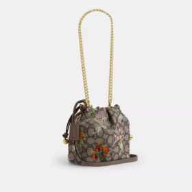 Faye Minitask i signatur-jacquard med blomsterbroderi