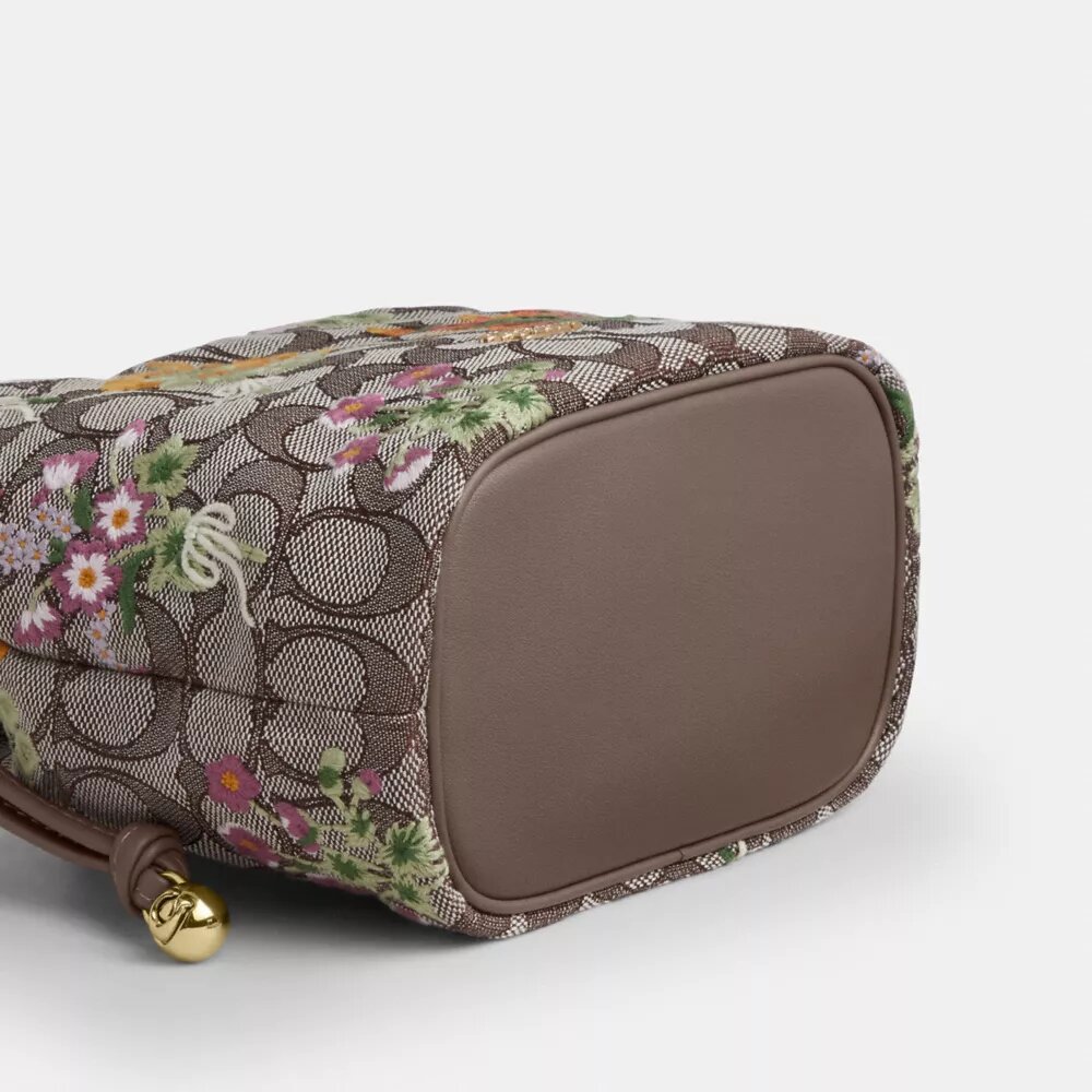 Faye Minitask i signatur-jacquard med blomsterbroderi