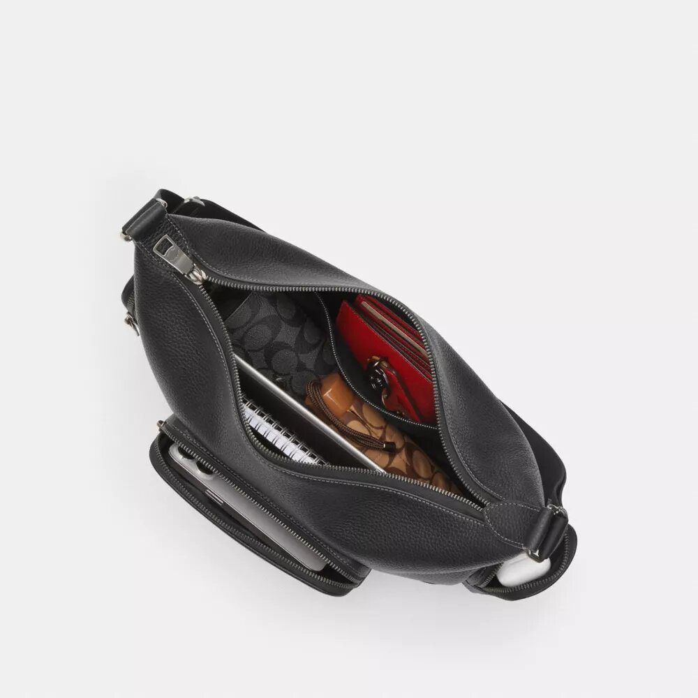 Finn crossbody-taske med lommer