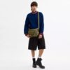 Finn crossbody-taske med lommer