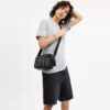 Graham-crossbody-taske i Signature Canvas med striber