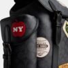 Hitch-rygsæk i Signature Canvas med patches