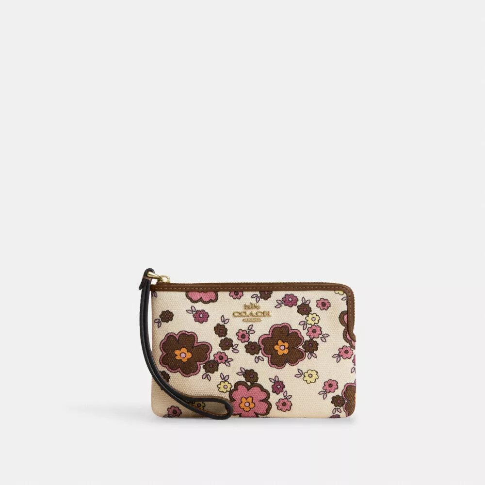 Håndledstaske med lynlås i hjørnet og blomsterprint