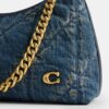 Juliet skuldertaske 25 i regenerativ bomuldsdenim med quiltning