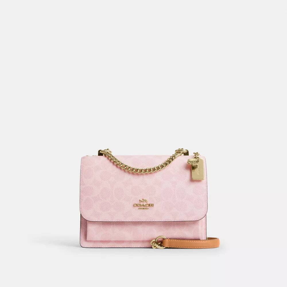 Klare crossbody-taske i Signature Canvas med vedhæng