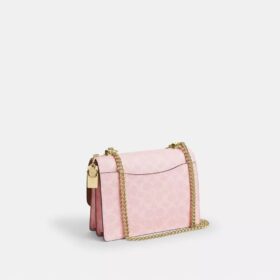 Klare crossbody-taske i Signature Canvas med vedhæng