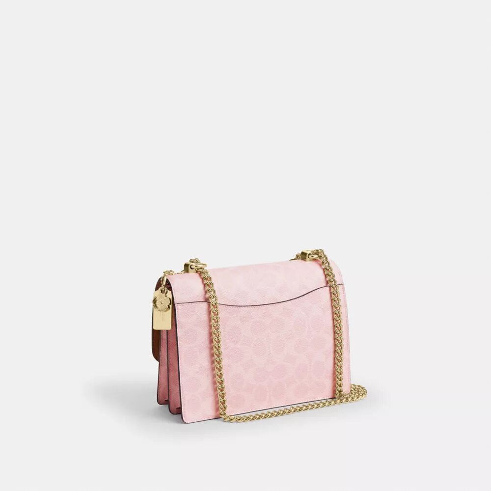 Klare crossbody-taske i Signature Canvas med vedhæng