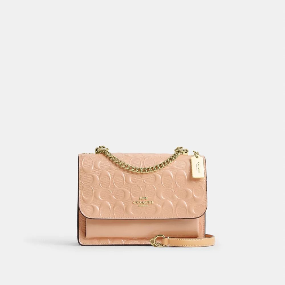 Klare crossbody-taske i signaturlæder