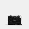 Klare crossbody-taske i signaturlæder