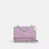Klare crossbody-taske i signaturlæder