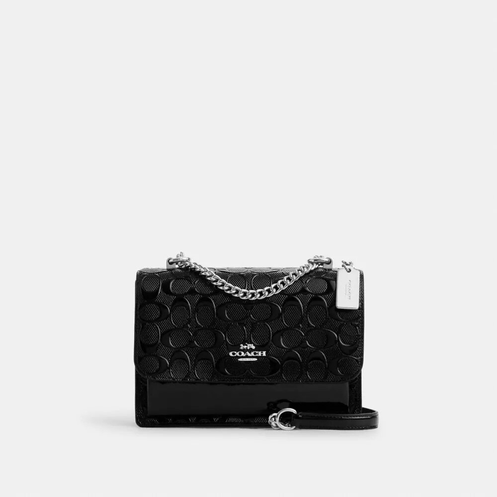 Klare crossbody-taske i signaturlæder