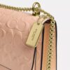 Klare crossbody-taske i signaturlæder