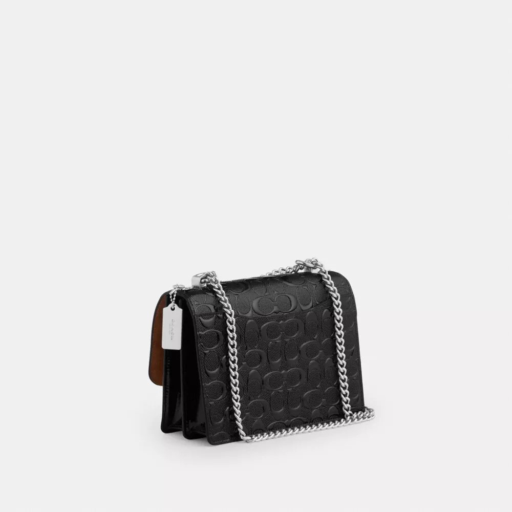 Klare crossbody-taske i signaturlæder