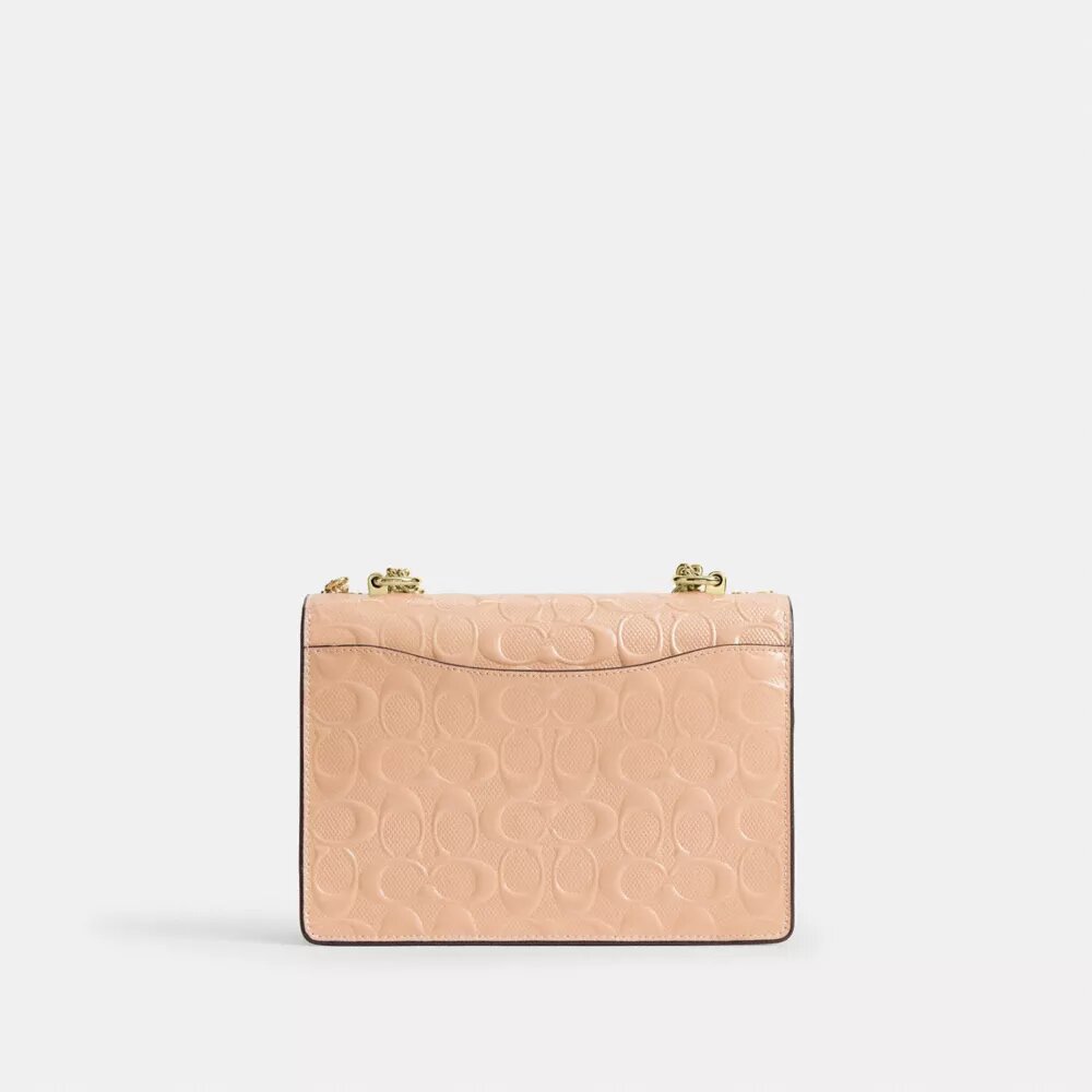 Klare crossbody-taske i signaturlæder