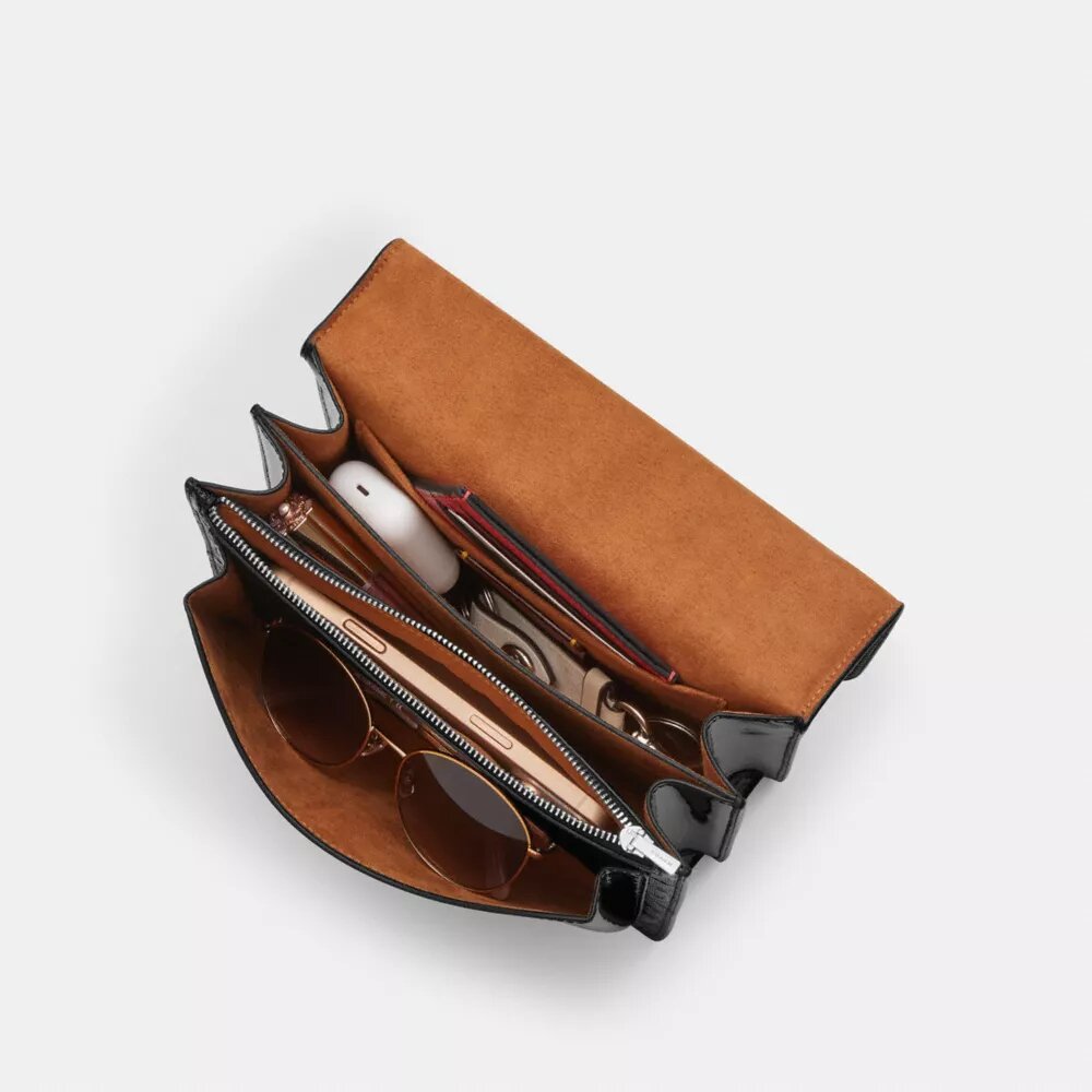 Klare crossbody-taske i signaturlæder