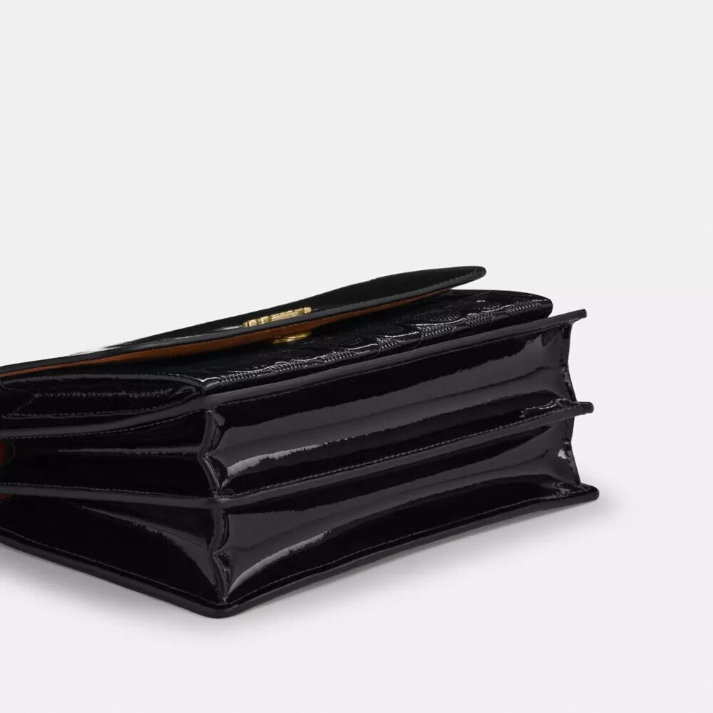 Klare crossbody-taske i signaturlæder