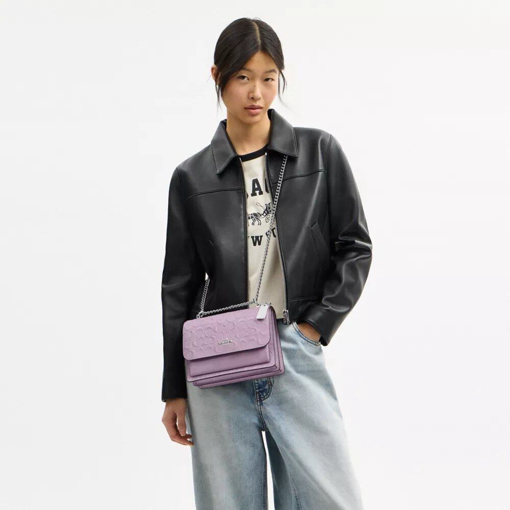 Klare crossbody-taske i signaturlæder