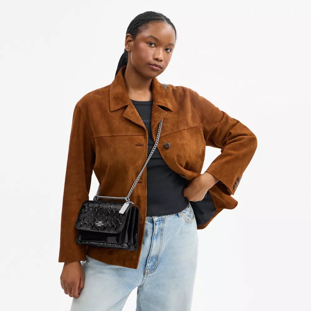 Klare crossbody-taske i signaturlæder