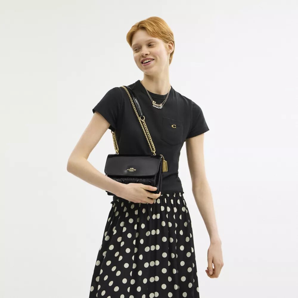 Klare crossbody-taske i signaturlæder