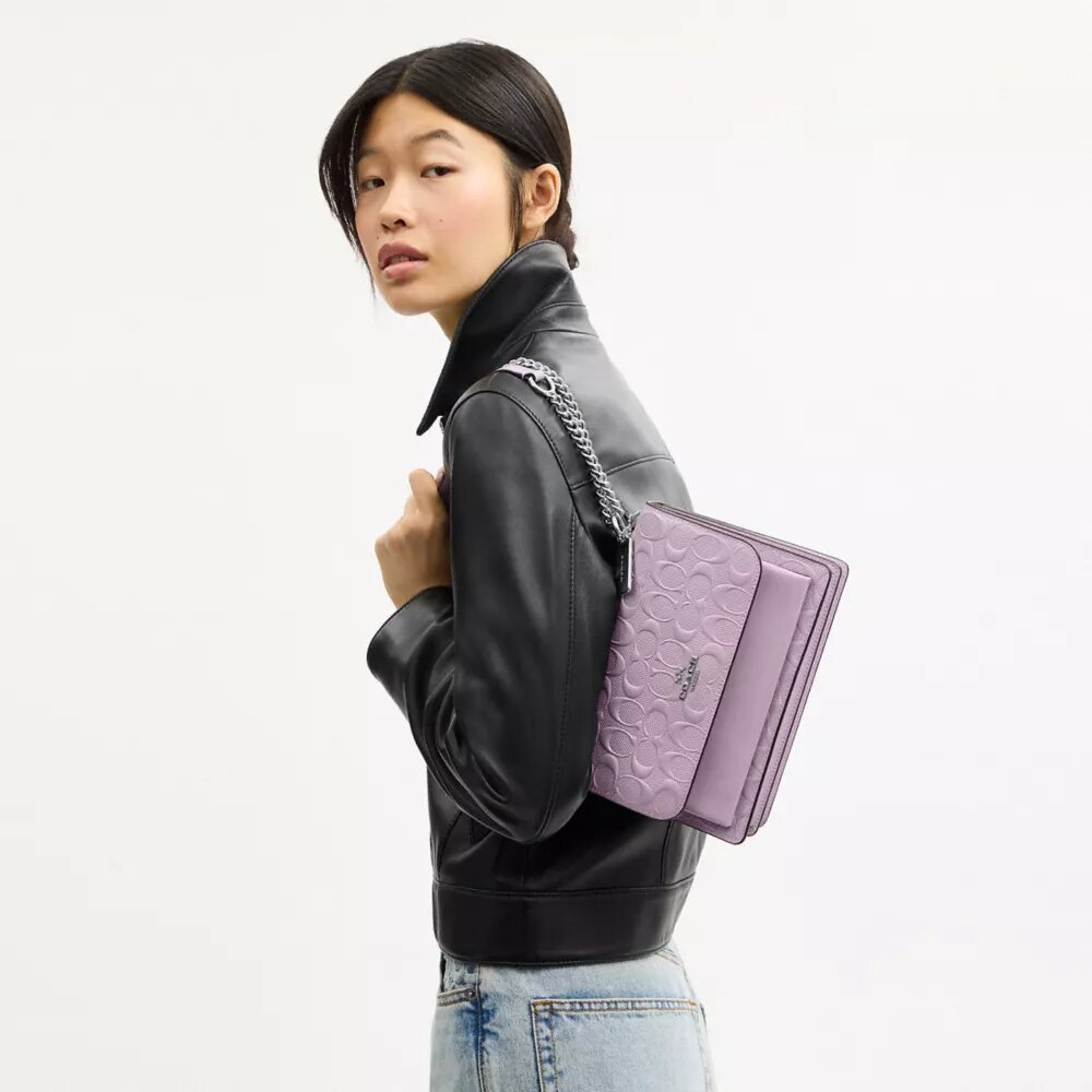 Klare crossbody-taske i signaturlæder
