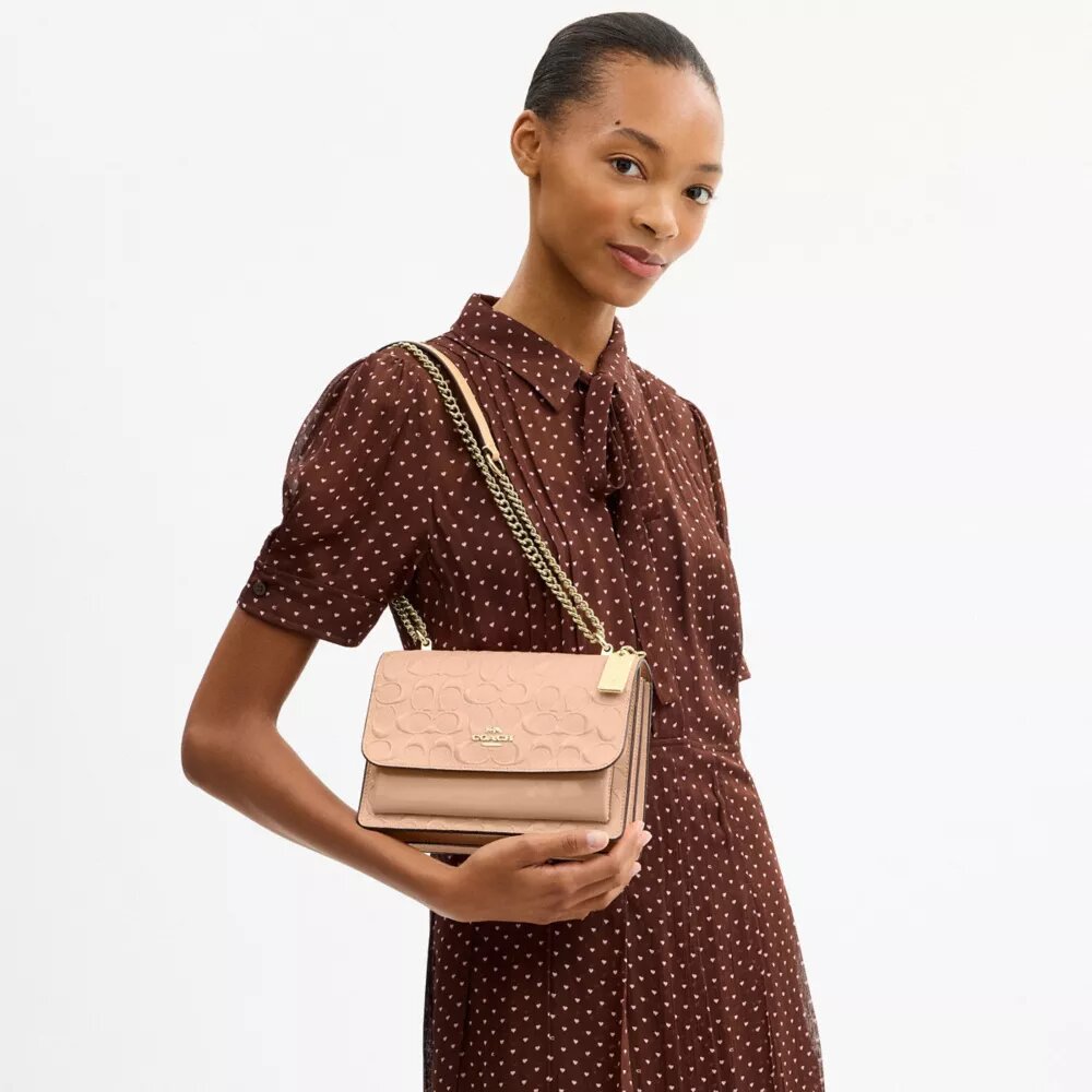 Klare crossbody-taske i signaturlæder