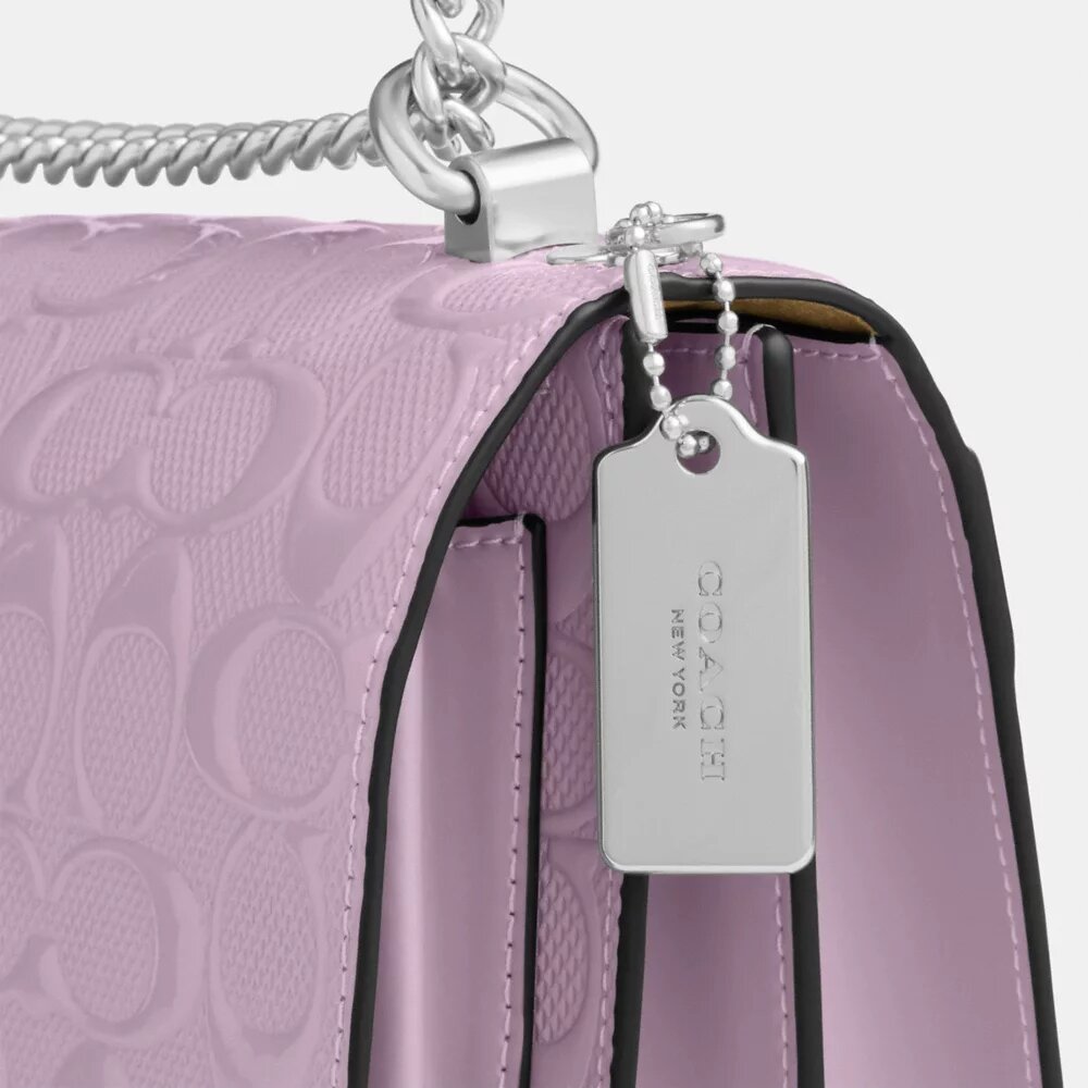 Klare crossbody-taske i signaturlæder