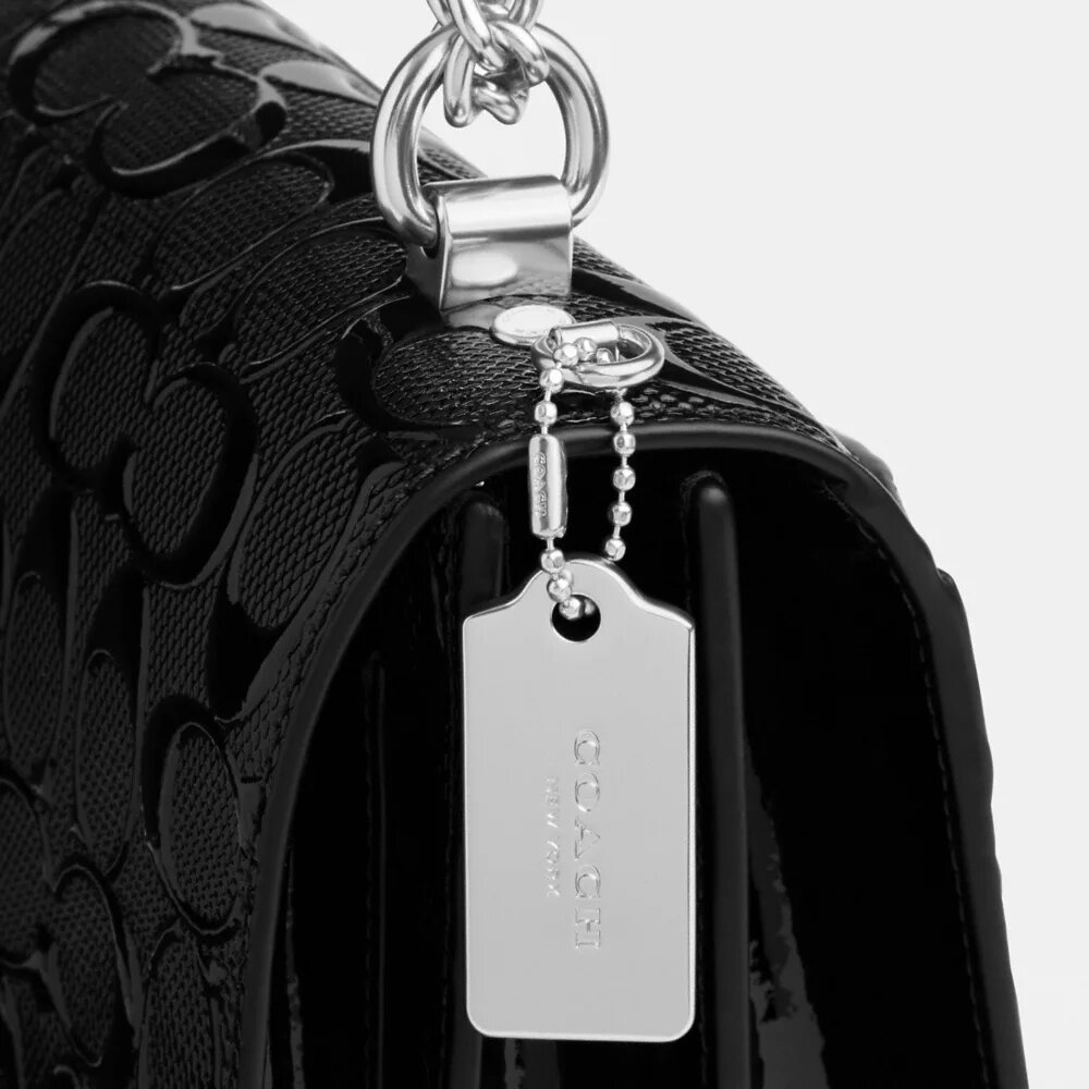 Klare crossbody-taske i signaturlæder