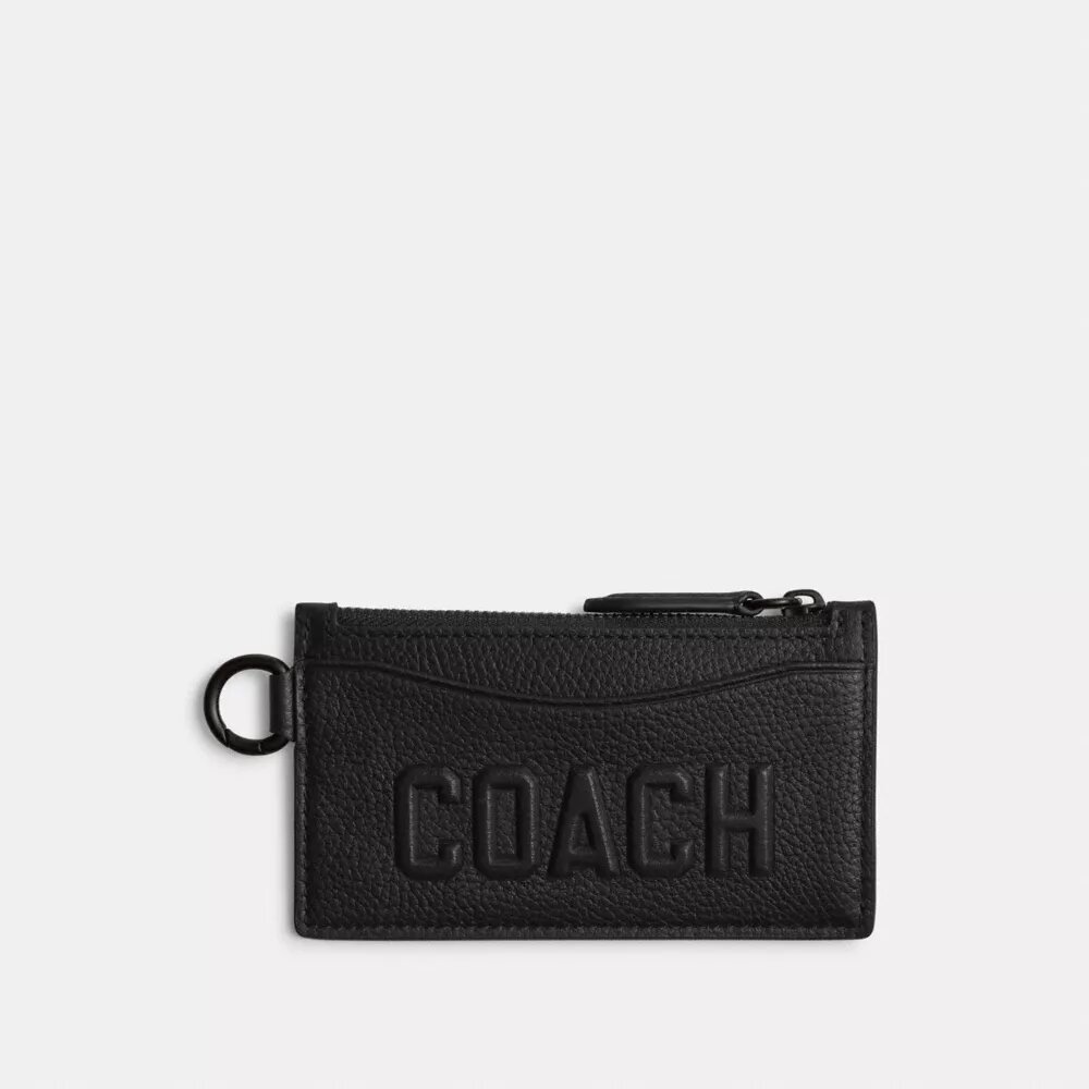 Kortetui med lynlås og Coach-grafik