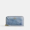 Lang pung med lynlås hele vejen rundt i Loved-denim