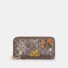Lang punge med lynlås hele vejen rundt i Signature-jacquard med blomsterbroderi