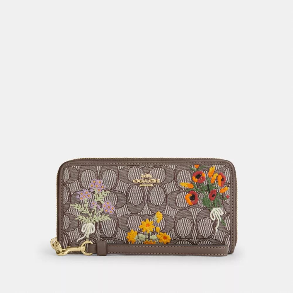Lang punge med lynlås hele vejen rundt i Signature-jacquard med blomsterbroderi