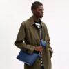 Lille Finn-crossbody-taske med punge