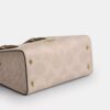 Maggie lille tote-taske i blokmønstret Signature Canvas