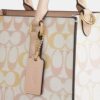 Maggie lille tote-tasker i Signature Canvas