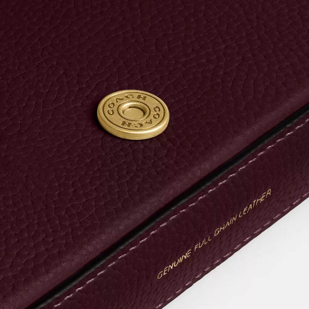Mila crossbody-taske med Signature Canvas